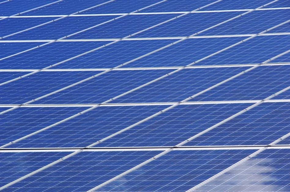 Close-up of rows of blue solar panels filling the frame