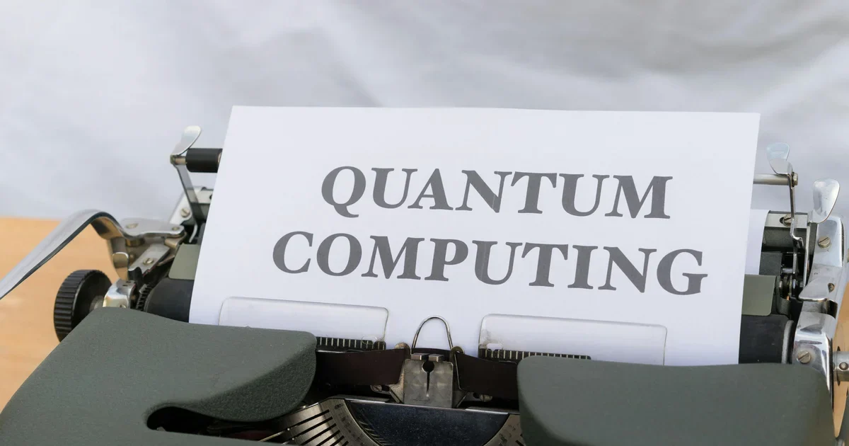 Typewriter with a sheet of paper reading Quantum Computing