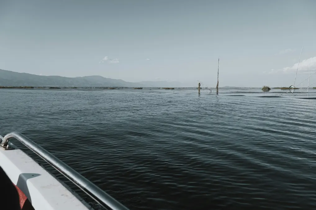 Calm waters of Loktak Lake in Manipur under a pale sky