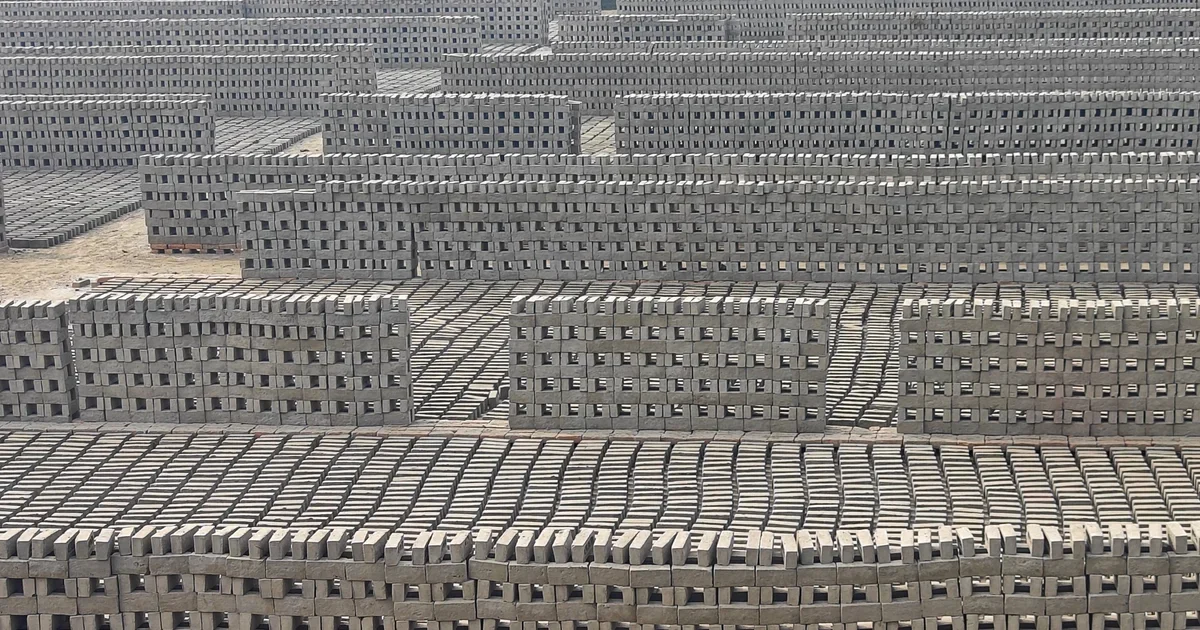 Rows of clay bricks stacked to dry in the sun at a brick yard in Haroa, West Bengal