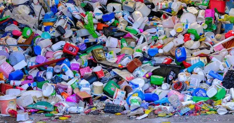 Large heap of used plastic bottles and containers sorted at a recycling centre